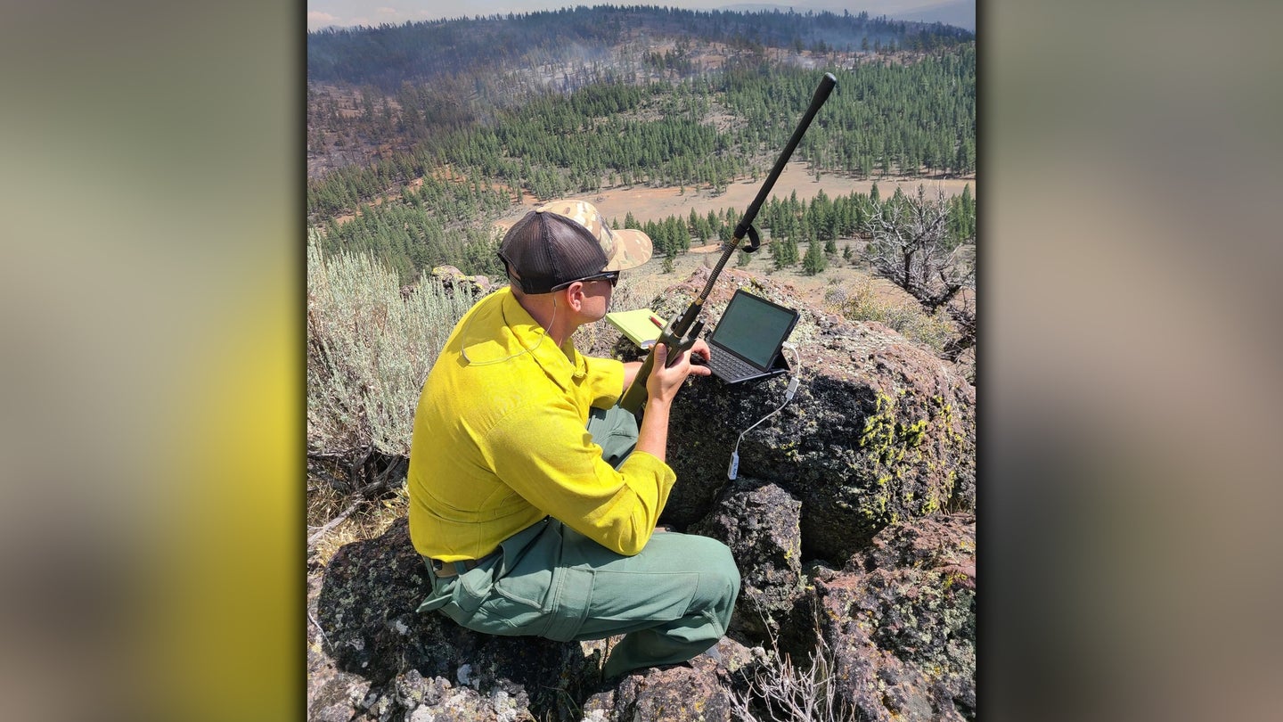Master Sgt. Brent Hill, Pennsylvania Air National Guard, controls the IR imagery on an RC26 in support of burn operations on the Beckwourth Fire in California from a location in western Nevada July 13. He is serving as part of a team of imagery experts providing live aerial video streaming to fire bosses working on the front lines of the devastating fires. (Air National Guard photo by Staff Sgt. William Gray)