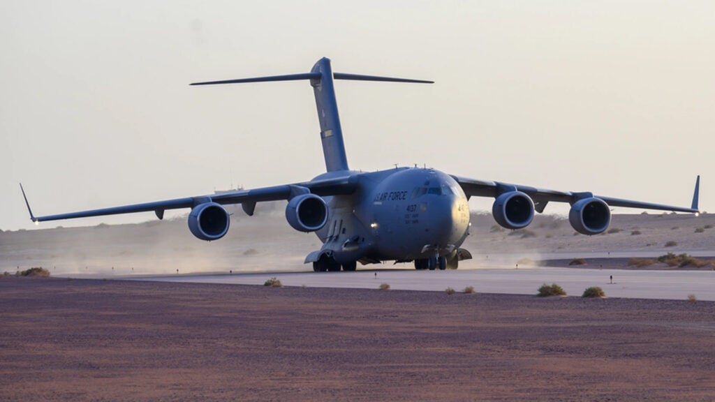 A U.S. Air Force C-17 Globemaster III lands on the runway at Prince Sultan Air Base, Kingdom of Saudi Arabia, prior to being loaded with cargo and personnel Aug. 18, 2021 (U.S. Air Force photo by Senior Airman Samuel Earick)