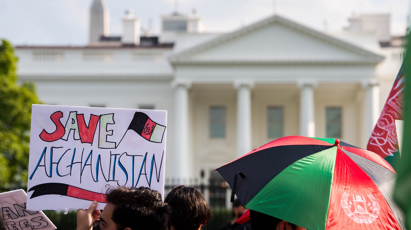 A "Save Afghanistan" sign is seen in front of the White House during a "Save Afghan Lives" protest on Aug. 28, 2021 in Washington, DC. The protest comes on the heels of a deadly bombing in Kabul this week as the U.S. and its allies rush to evacuate people from Afghanistan before the August 31st withdrawal deadline. (Photo by Liz Lynch/Getty Images)