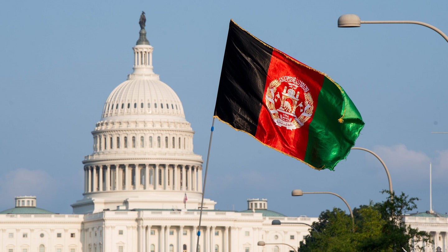 An Afghanistan flag is seen waving in front of the U.S. Capitol on August 28, 2021 in Washington, DC. The protest comes on the heels of a deadly bombing in Kabul this week as the U.S. and its allies rush to evacuate people from Afghanistan before the August 31st withdrawal deadline. (Photo by Liz Lynch/Getty Images)