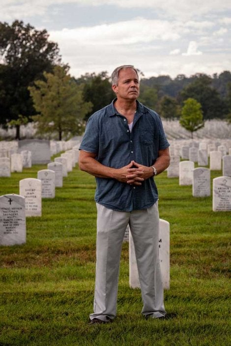 Robert Hogue reflects on the lives lost throughout the global war on terror while walking through Arlington National Military Cemetery. (Photo by Eliot Dudik, for The War Horse.)