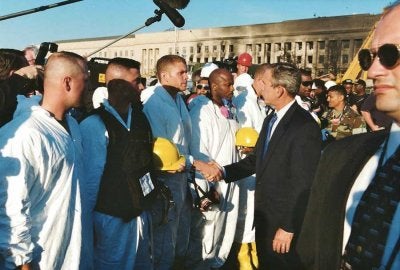 Eric Jones shakes the hand of then-President George W. Bush during search-and-rescue efforts at the Pentagon. (Photo courtesy of Eric Jones.)