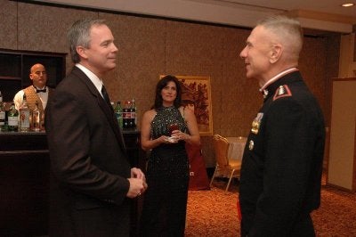 Robert Hogue and his wife, Cheryl, stand with Gen. Michael Hagee, then-commandant of the Marine Corps. (Photo courtesy of Robert Hogue.)
