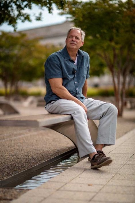 Robert Hogue reflects on the 20th anniversary of the attack while seated at the Pentagon 9/11 Memorial. (Photo by Eliot Dudik, for The War Horse.)