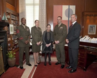 Robert Hogue (right), Capt. Kelly Repair (second from left), and fellow Marines stand beside associate justice Ruth Bader Ginsburg in her chambers at the Supreme Court. (Photo courtesy of Robert Hogue.)