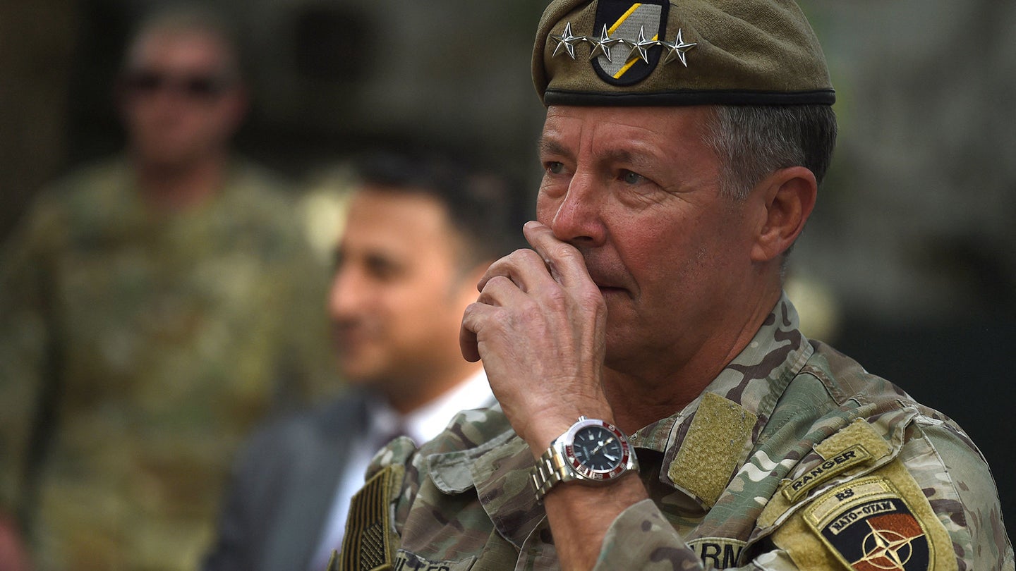 Gen. Austin "Scott" Miller, US top commander of coalition forces in Afghanistan, gestures during an official handover ceremony at the Resolute Support headquarters in the Green Zone in Kabul on July 12, 2021. (Photo by WAKIL KOHSAR / AFP) (Photo by WAKIL KOHSAR/AFP via Getty Images)