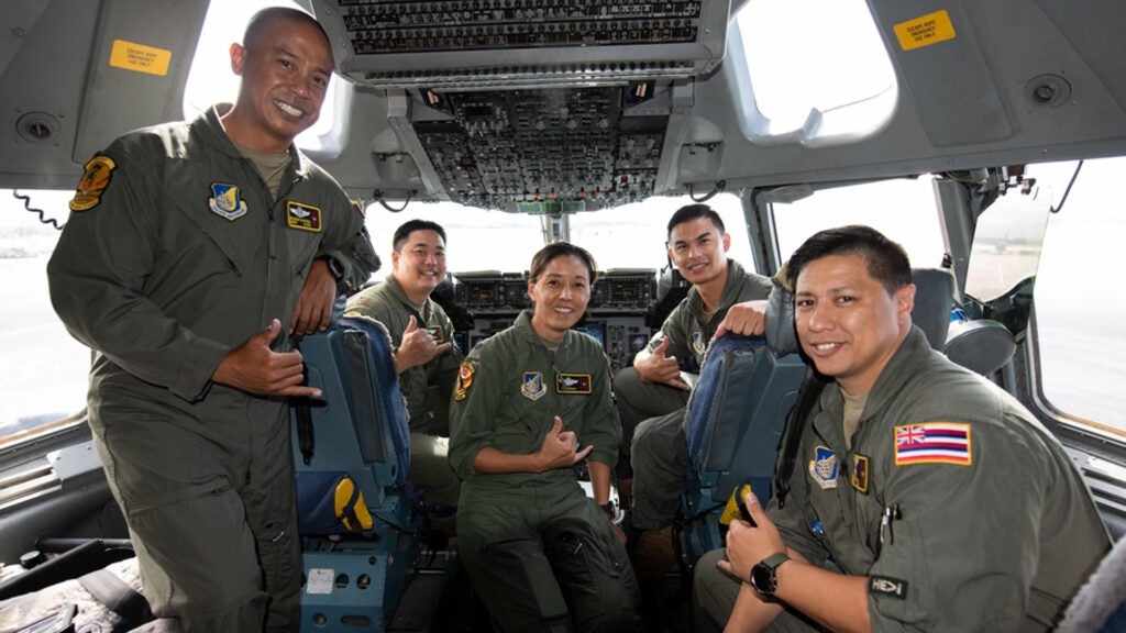 An all-Asian American and Pacific Islander aircrew from the 204th and 535th Airlift Squadrons conduct a training mission on a C-17 Globemaster III May 25, 2021, at Joint Base Pearl Harbor-Hickam, Hawaii. In observance of AAPI Heritage Month, the aircrew joined other aircraft, flown by AAPI Airmen, in a practice refueling mission. AAPIs in the military and maintain a legacy of service and sacrifice set by those before them. (U.S. Air National Guard photo by Staff Sgt. Orlando Corpuz)