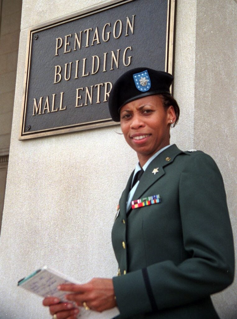 Lt. Col. Marilyn Wills, Army deputy chief of staff for Personnel Congressional Affairs, of Monroe, La. sports her new black beret outside the Pentagon Thursday, June 14, 2001. Soldiers carefully positioned their new black berets on Thursday as the Army adopted a new headgear that symbolizes a new philosophy in a new era. (AP Photo/Heesoon Yim)
