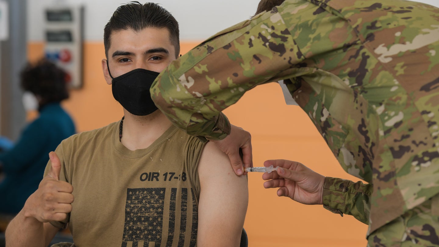 U.S. Army Sgt. Angel Robles, left, with 3rd Squadron, 2nd Cavalry Regiment, receives a COVID-19 vaccination at the 7th Army Training Command's (7ATC) Rose Barracks, Vilseck, Germany, May 3, 2021. The U.S. Army Health Clinics at Grafenwoehr and Vilseck conducted a "One Community" COVID-19 vaccine drive May 3-7 to provide thousands of appointments to the 7ATC community of Soldiers, spouses, Department of the Army civilians, veterans and local nationals employed by the U.S. Army.
(U.S. Army photo by Markus Rauchenberger)