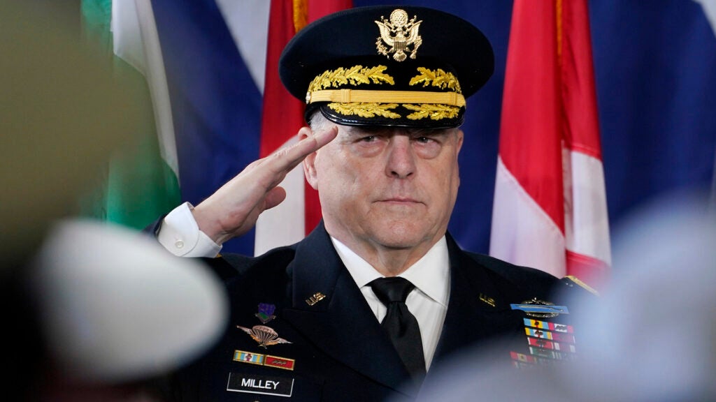 Chairman of the Joint Chiefs of staff, Gen. Mark Milley salutes during a ceremony marking full operation of the NATO's Joint force Command aboard the USS Kearsarge at Naval Station Norfolk Thursday July 15, 2021, in Norfolk, Va. (AP Photo/Steve Helber)