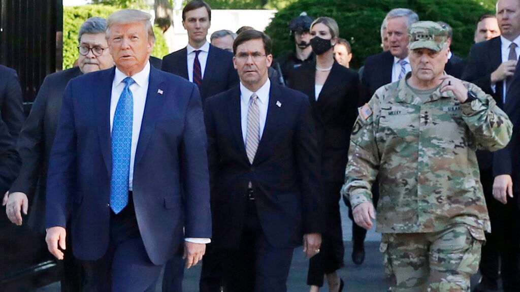Then-President Donald Trump departs the White House to visit outside St. John's Church, in Washington. Walking behind Trump from left are, Attorney General William Barr, Secretary of Defense Mark Esper and Gen. Mark Milley, chairman of the Joint Chiefs of Staff. (Patrick Semansky/AP)