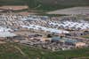 Area photo of Fort Bliss’ Doña Ana Complex in New Mexico, Aug. 30, 2021. The Department of Defense, through U.S. Northern Command, and in support of the Department of Homeland Security, is providing transportation, temporary housing, medical screening, and general support for up to 50,000 Afghan evacuees at suitable facilities, in permanent or temporary structures, as quickly as possible. This initiative provides Afghan personnel essential support at secure locations outside Afghanistan. (U.S. Army photo by Pfc. Luis Santiago)