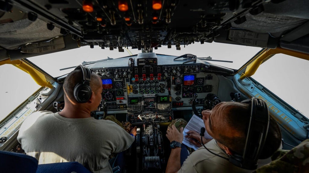 Pilots, from the 340th Expeditionary Air Refueling Squadron, perform an in-flight checklist during a flight in support of Operation Inherent Resolve Aug. 30, 2017. The KC-135 provides aerial refueling capabilities as it supports U.S. and Coalition forces working to liberate territory and people under the control of ISIS. (U.S. Air Force photo by Staff Sgt. Michael Battles)
