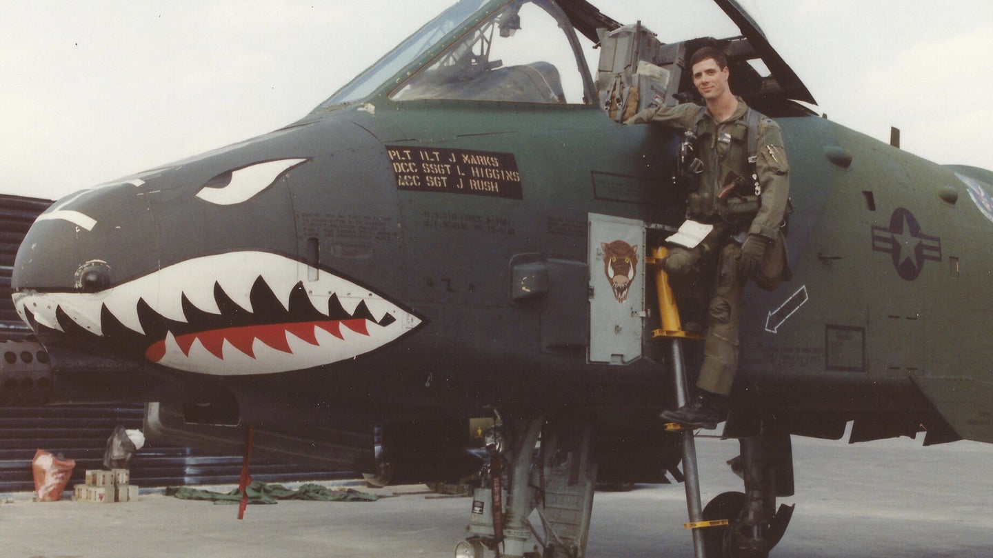 Then-Lt. John Marks, stands on the ladder of an A-10 Thunderbolt II at King Fahd Air Base, Saudi Arabia, during Desert Storm in February, 1991. Destroying and damaging more than 30 Iraqi tanks was one of Marks most memorable combat missions during Desert Storm. (Photo courtesy of Lt. Col. John Marks)