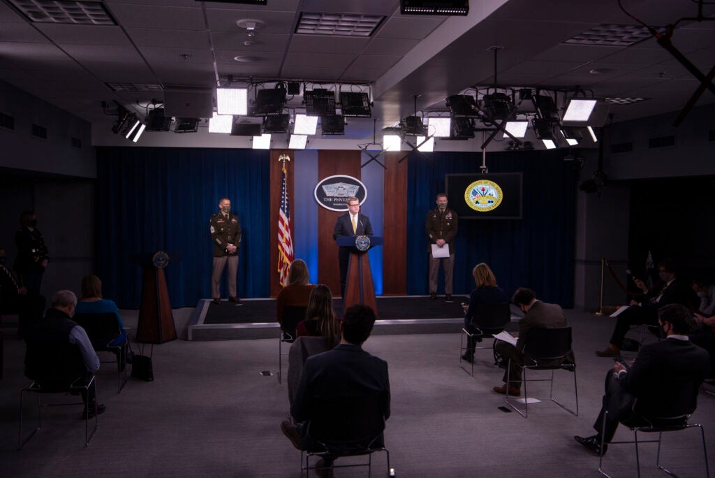 Army Secretary Ryan D. McCarthy, with Army Chief of Staff Gen. James C. McConville (right), and Sergeant Major of the Army Michael A. Grinston, briefs the media on the Fort Hood Independent Review, at the Pentagon, Washington, D.C., Dec. 8, 2020. (U.S. Air Force photo by Staff Sgt. Brittany A. Chase)