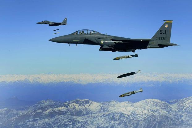 U.S. Air Force F-15E Strike Eagles drop 2,000-pound Joint Direct Attack Munitions on a cave in eastern Afghanistan on Nov. 26, 2009. (Michael B. Keller/U.S. Air Force)
