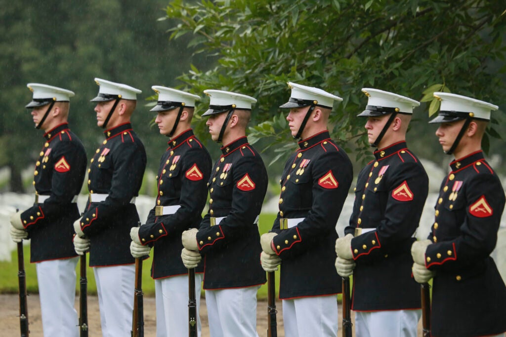 Marines with the Bravo Company firing party, Marine Barracks Washington D.C., stand at a ceremonial position during a full honors funeral for three formerly unaccounted for Vietnam veterans at Arlington National Cemetery, Arlington, Va., Sept. 27, 2018. Capt. John A. House II, Cpl. Glyn L. Runnels, Jr. and Lance Cpl. John D. Killen III were accounted for on Dec. 22, 2015 and buried together in Arlington. The Marines died when their CH-64A Sea Knight helicopter was struck by enemy fire and crashed, June 30, 1967. House, who piloted the helicopter, was attempting to insert eight members of Company A, 3rd Reconnaissance Battalion, 3rd Marine Division, into hostile territory in Thau Thien-Hue Province, Vietnam, when enemy forces attacked from a surrounding tree line. Lance Cpl. Merlin R. Allen and Navy Hospital Corpsman Michael B. Judd also died during the crash and were individually identified in 2013. (U.S. Marine Corps photo by Sgt. Robert Knapp/Released)