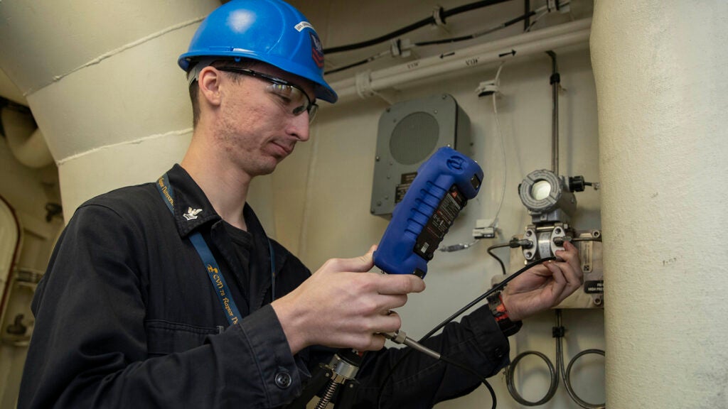 NEWPORT NEWS, Va. (March 14, 2019) Machinist's Mate (Nuclear) 2nd Class Daniel Brzezinskirockwell, from Craig, Colorado, assigned to USS Gerald R. Ford's (CVN 78) reactor department, tests a pressure gauge during a routine maintenance check. Ford is currently undergoing its post-shakedown availability at Huntington Ingalls Industries-Newport News Shipbuilding. (U.S. Navy photo by Mass Communication Specialist 2nd Class Ryan Seelbach)