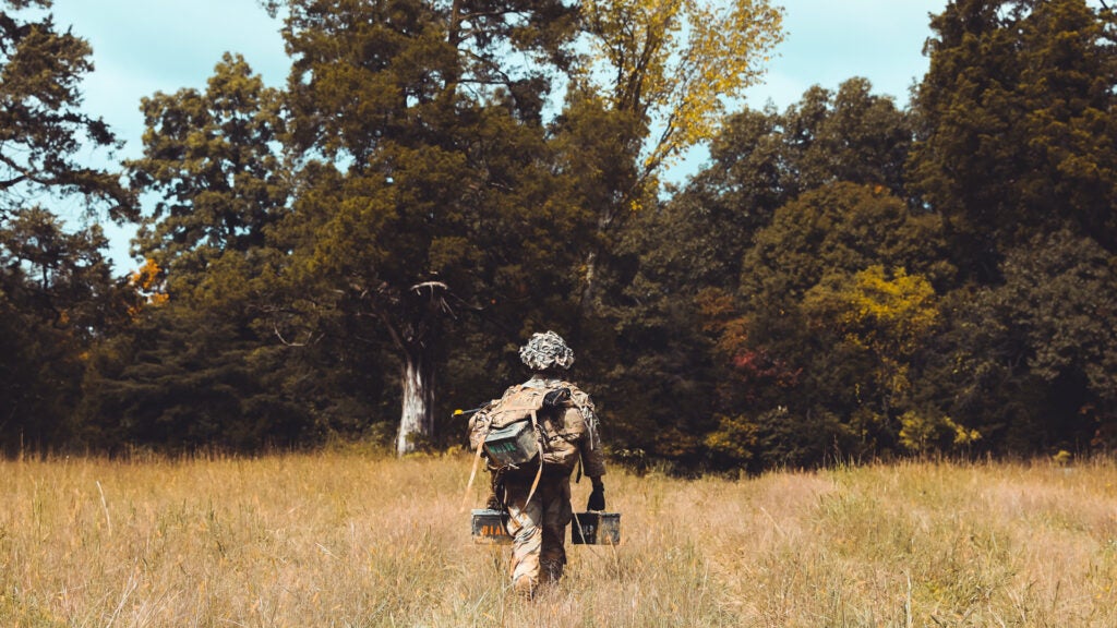 A soldier carries ammunition boxes during the Army’s Best Warrior Competition on Fort Knox, Ky., Oct. 4, 2021. (U.S. Army photo/Spc. Mario Hernandez Lopez)