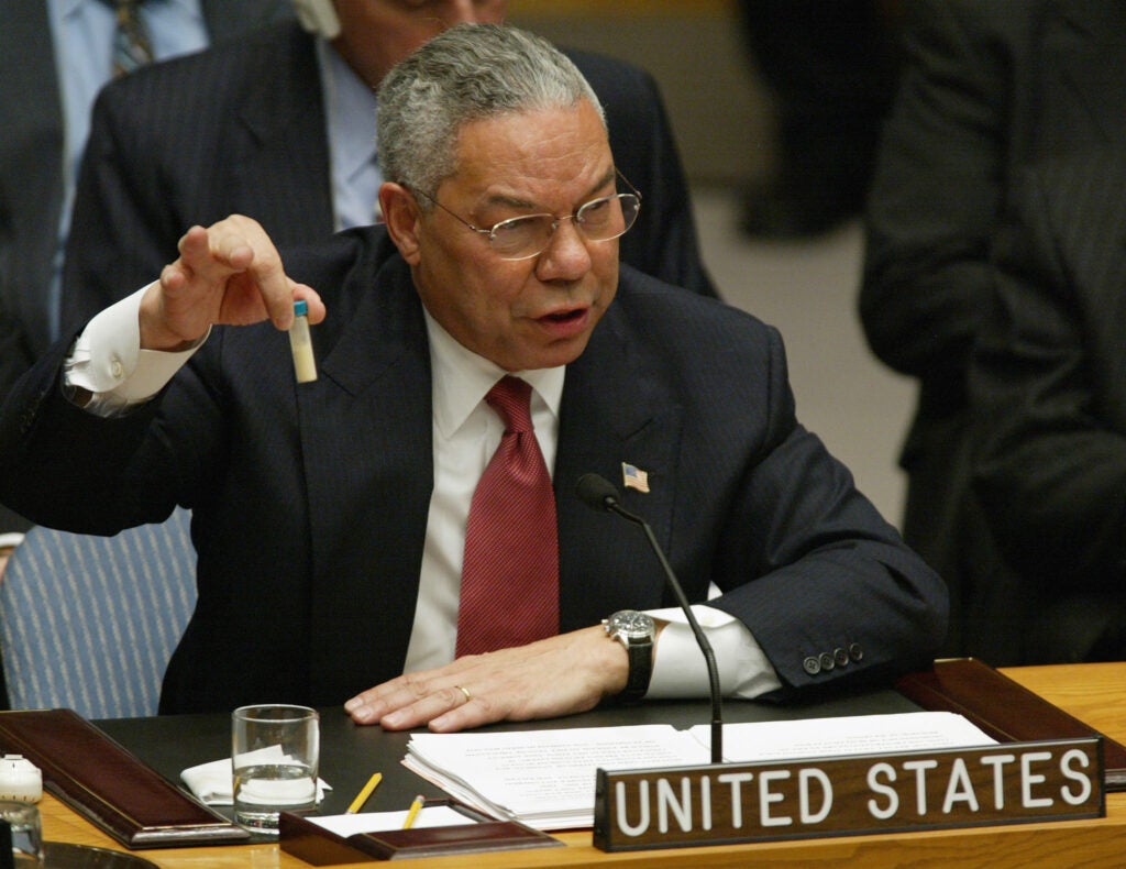 US Secretary of State Colin Powell holds up a vial that he said was the size that could be used to hold anthrax as he addresses the United Nations Security Council 05 February, 2003 at the UN in New York.  Powell urged the UN Security Council to say "enough" to what he said was Iraq's 12 years of defiance of international attempts to destroy its chemical and biological weapons. AFP PHOTO/Timothy A. CLARY (Photo credit should read TIMOTHY A. CLARY/AFP via Getty Images)