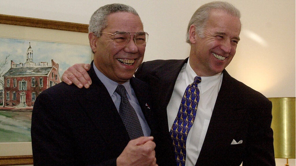 FILE PHOTO: Then- Secretary of State-designate Colin Powell, left, and Sen. Joseph Biden, D-Del., pose for photographers on Capitol Hill Tuesday, Jan. 9, 2001. (AP Photo/Dennis Cook)