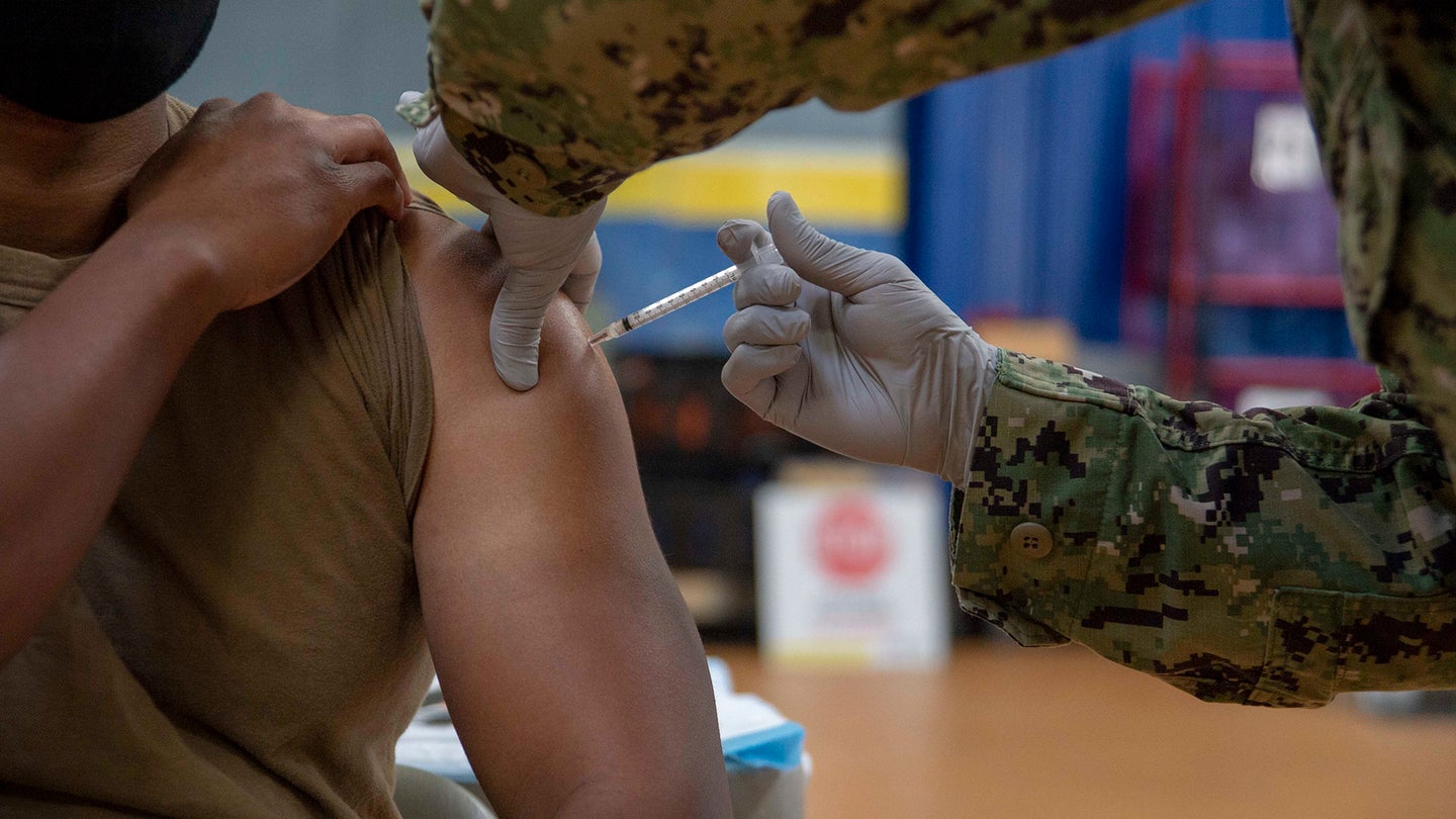 A sailor receives the coronavirus (COVID-19) vaccine on board Naval Base San Diego's Adm. James Prout gymnasium Jan. 22. (U.S. Navy photo by Mass Communication Specialist Seaman Luke Cunningham)