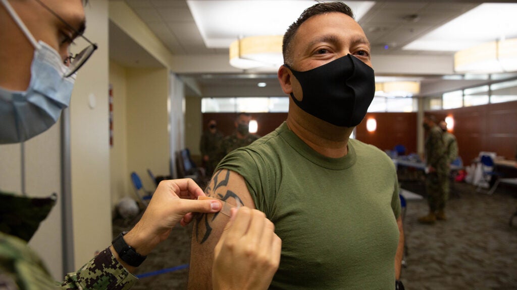 FILE PHOTO: A Marine receives the COVID-19 vaccination on Marine Corps Base Camp Pendleton, California, Jan. 15, 2021. (U.S. Marine Corps photo by Lance Cpl. Quince Bisard)