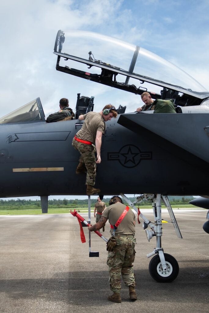 U.S. Air Force Airmen from the 389th Fighter Squadron recover an F-15E Strike Eagle on Tinian International Airport, July 27, 2021. (U.S. Air Force photo by Airman 1st Class Andrea Rozoto)