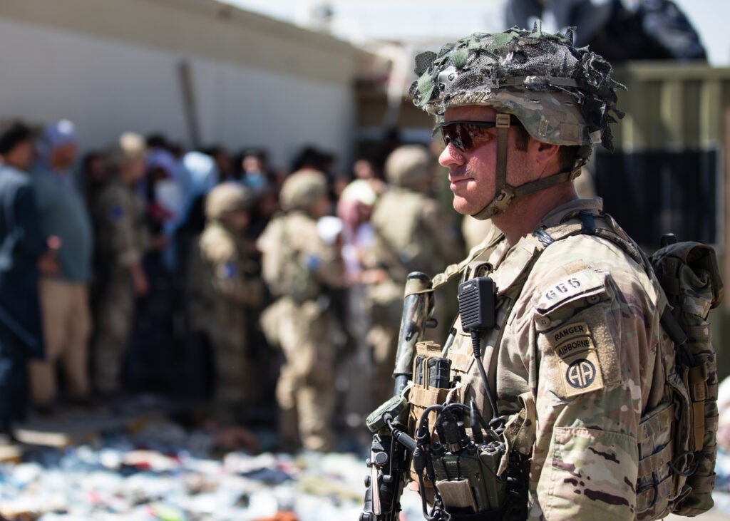 A Paratrooper assigned to the 1st Brigade Combat Team, 82nd Airborne Division conducts security as the Division continues to help facilitate the safe evacuation of U.S. citizens, Special Immigrant Visa applicants, and other at-risk Afghans out of Afghanistan as quickly and safely as possible from Hamid Karzai International Airport in Kabul, Aug 26, 2021.