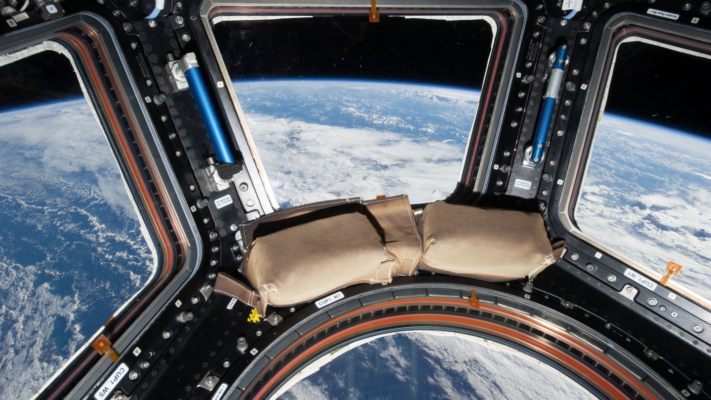 Close-up view of International Space Station cupola windows (with earth visible) as documented by the Expedition 36 crew, 2013. (NASA photo / Karen Nyberg)
