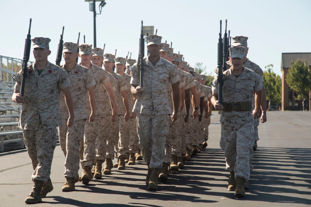 U.S. Marine Corps Officer Candidates attending Officer Candidate School (OCS), practice close order drill on the parade deck at Marine Corps Base Quantico VA., Oct. 17, 2017. The mission of OCS is to educate and screen individuals for qualities required for commissioning as a Marine Corps officer. (U.S. Marine Corps photo by Lance Cpl. Tyler Pender)