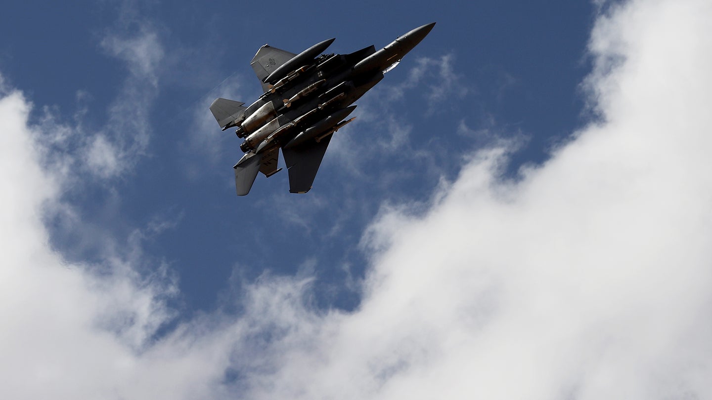 FILE PHOTO: A U.S. Air Force F-15E Strike Eagle fighter jet conducts a simulated attack run near At-Tanf Garrison, Syria, June 13, 2020. (U.S. Army photo by Staff Sgt. William Howard)
