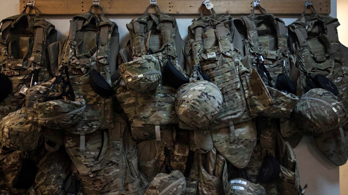 Body armor belonging to members of the 455th Expeditionary Aircraft Maintenance Squadron hangs from hooks in the C-130J Hercules aircraft maintenance unit Dec. 9, 2016 at Bagram Airfield, Afghanistan. (U.S. Air Force photo by Staff Sgt. Katherine Spessa)