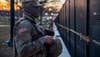 A U.S. Soldier with the Oklahoma National Guard, stands watch along a perimeter fence near the U.S. Capitol building in Washington, D.C., Jan. 20, 2021. At least 25,000 National Guard men and women have been authorized to conduct security, communication and logistical missions in support of federal and District authorities leading up to and through the 59th Presidential Inauguration. (U.S. Army National Guard photo by Sgt. Anthony Jones)