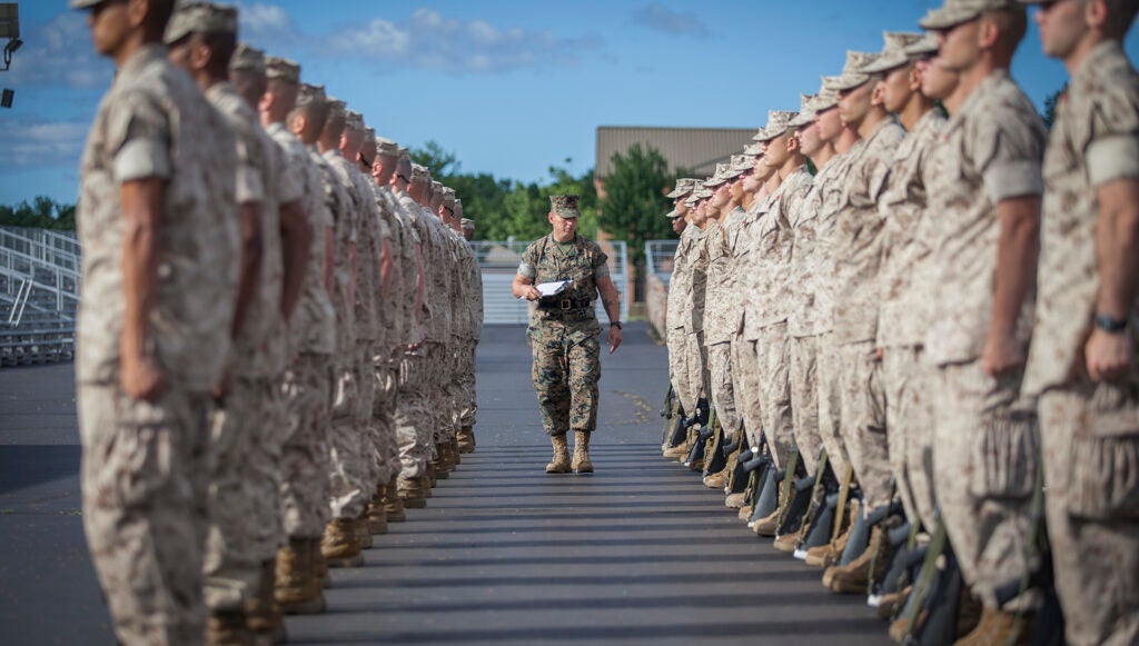 Gunnery Sgt. Anthony Stockman, a sergeant instructor, evaluates officer candidates during close order drill at Marine Corps Officer Candidates School aboard Marine Corps Base Quantico, Virginia, June 21, 2019. (Lance Cpl. Phuchung Nguyen/U.S. Marine Corps)