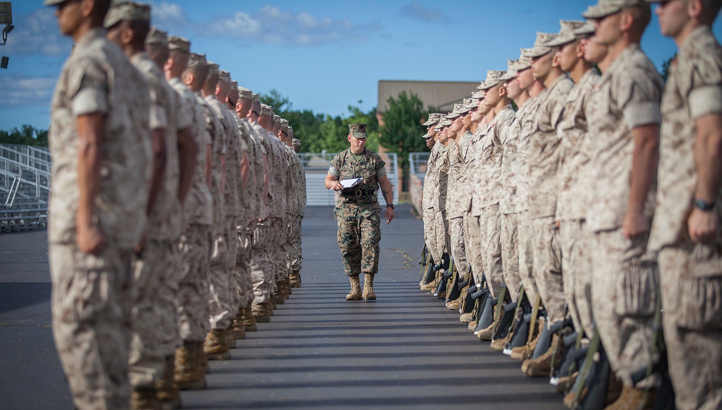 Gunnery Sgt. Anthony Stockman, a sergeant instructor, evaluates officer candidates during close order drill at Marine Corps Officer Candidates School aboard Marine Corps Base Quantico, Virginia, June 21, 2019. (Lance Cpl. Phuchung Nguyen/U.S. Marine Corps)