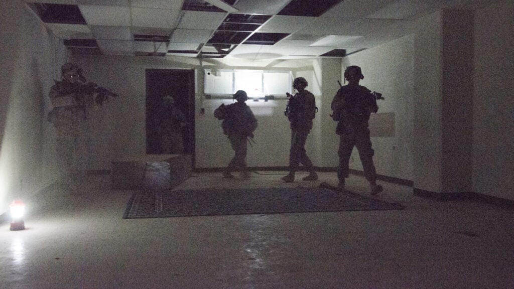 Using night vision equipment soldiers clear a room in an underground facility during NIE 13.2, May 12, 2013 (Air Force photo / John Hamilton)