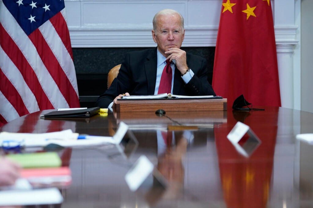 FILE - President Joe Biden listens as he meets virtually with Chinese President Xi Jinping from the Roosevelt Room of the White House in Washington, Nov. 15, 2021. The Biden administration has invited Taiwan to its upcoming Summit for Democracy, prompting sharp criticism from China, which considers the self-ruled island as its territory. The invitation list features 110 countries, including Taiwan, but does not include China or Russia.  (AP Photo/Susan Walsh, File)