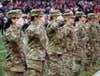 Soldiers and Airmen of the Ohio National Guard salute the flag being raised at the Ohio State University Military Appreciation game at the Ohio Stadium, Nov. 13th, 2021. (U.S. Army National Guard photo by Spc. Grace Jacobs/RELEASED)