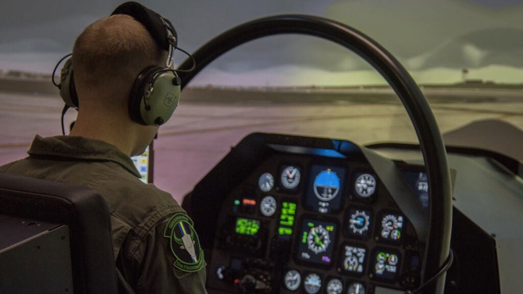 Staff Sgt. Jeffrey, 558th Flying Training Squadron remotely piloted aircraft student pilot, prepares to take flight in the T-6 Texan II flight simulator Feb. 5, 2019 at Joint Base San Antonio-Randolph, Texas.  (U.S. Air Force illustration by Airman 1st Class Shelby L. Pruitt)