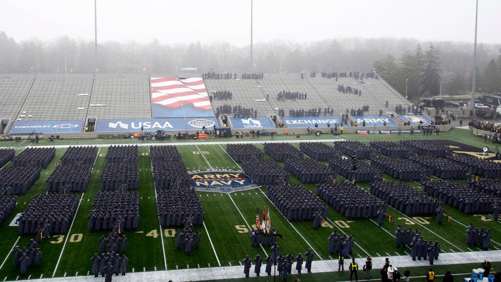 FILE - Army cadets march on the field before an NCAA college football game against Navy in West Point, N.Y., in this Saturday, Dec. 12, 2020, file photo. Bump Army-Navy or go head-to-head with NFL? That's the choice facing those in charge with expanding the College Football Playoff if they want to take the format from four to 12 teams. (AP Photo/Adam Hunger, File)