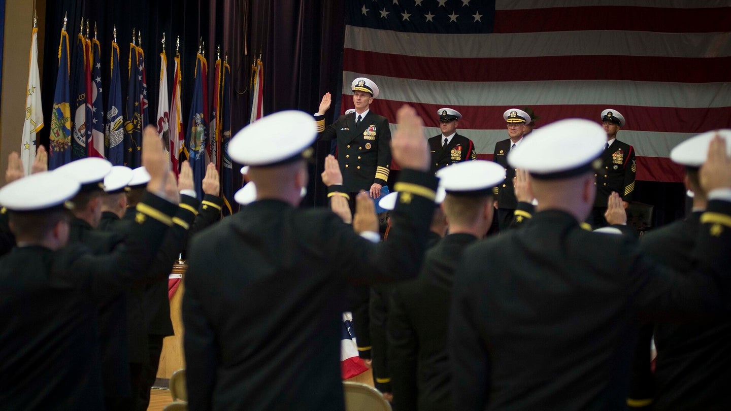 Chief of Naval Operations Adm. Jonathan Greenert administers the oath of office to 85 officer candidates during an officer candidate school graduation ceremony at Officer Training Command Newport. Greenert was also the guest speaker at the event. (U.S. Navy photo by Chief Mass Communication Specialist Peter D. Lawlor)
