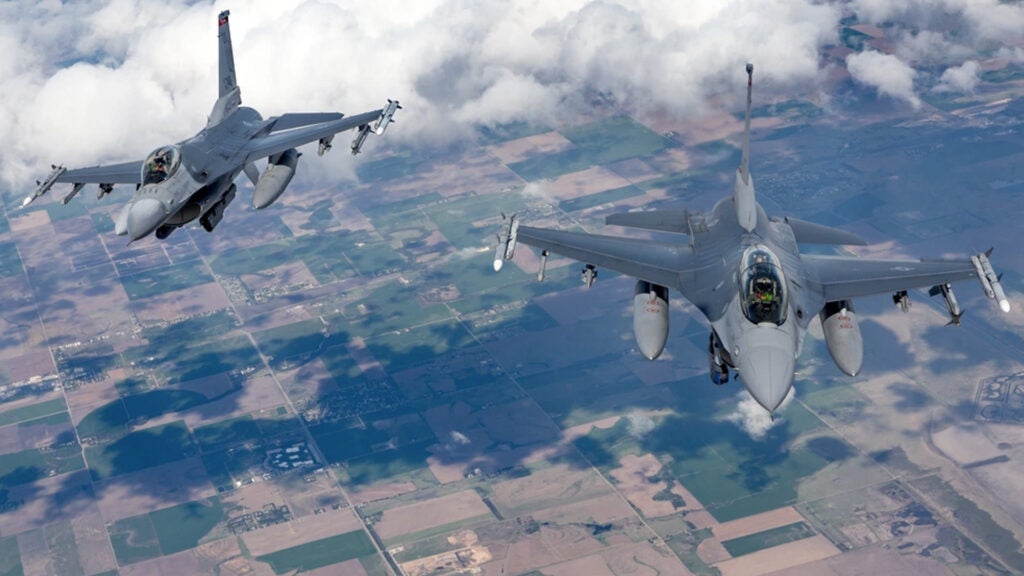Two 138th Fighter Wing F-16 Fighting Falcons from Tulsa Air National Guard Base, Oklahoma, fly behind a KC-135R Stratotanker April 25, 2019. The Stratotanker, from the 507th Air Refueling Wing at Tinker Air Force Base, Oklahoma, refueled four 138th Fighter Wing F-16 Fighting Falcons during flight operations over Kansas. (Courtesy photo by Mike Killian)