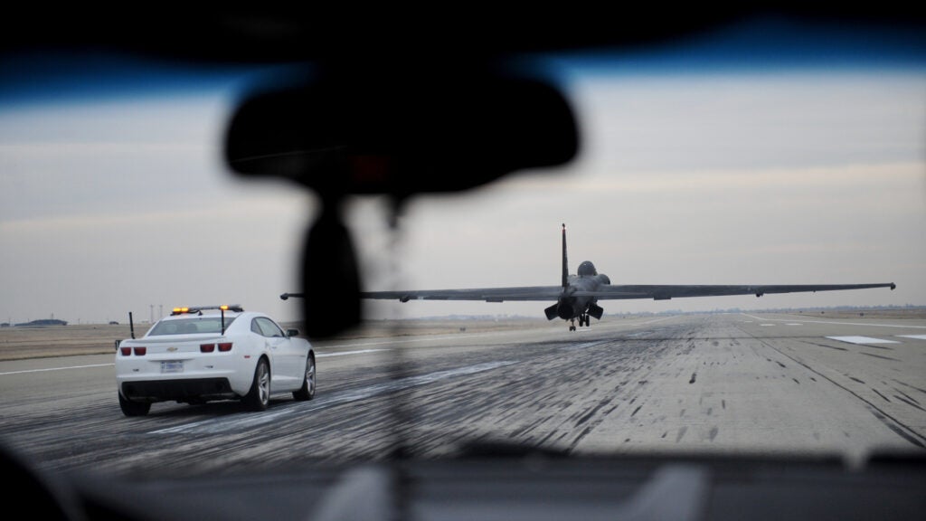Col. Phil Stewart, 9th Reconnaissance Wing commander, pursues a U-2 Dragon Lady in a mobile chase car at Beale Air Force Base, Calif., Dec. 6, 2013. Stewart was escorting retired NASA astronaut Robert Gibson who was serving as a guest speaker at the wing holiday party. (U.S. Air Force photo by Airman 1st Class Bobby Cummings/Released)