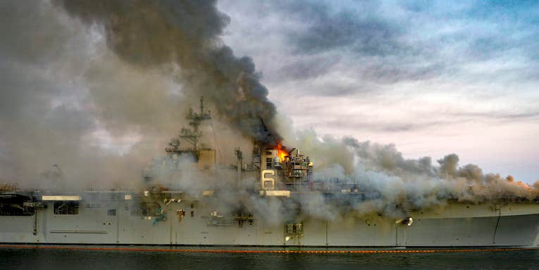 A Navy warship burned while commanders argued over who was in charge