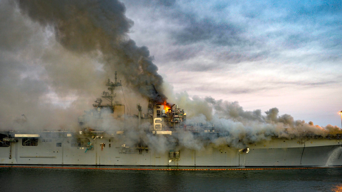 A Navy warship burned while commanders argued over who was in charge
