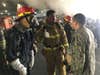 SAN DIEGO , CA - JULY 12: Sailors aboard the amphibious assault ship USS Bonhomme Richard (LHD 6) converse about a fire aboard the ship at Naval Station San Diego, July 12, 2020. On the morning of July 12, a fire was called away aboard the ship while it was moored pierside at Naval Base San Diego. Local, base and shipboard firefighters responded to the fire. USS Bonhomme Richard is going through a maintenance availability, which began in 2018. (Photo by Mass Communication Specialist 1st Class Jason Kofonow/U.S. Navy via Getty Images)