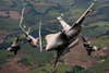 Two U.S. Air Force F-35A Lightning II aircraft and two French Rafale aircraft break formation during flight over France, May 18, 2021, during Atlantic Trident 21. The multinational exercise involved service members from the U.S., France and the U.K., and sought to enhance integration, combat readiness and fighting capabilities through complex air operations in a contested joint force environment. (Photo /  Air Force Staff Sgt. Alexander Cook)