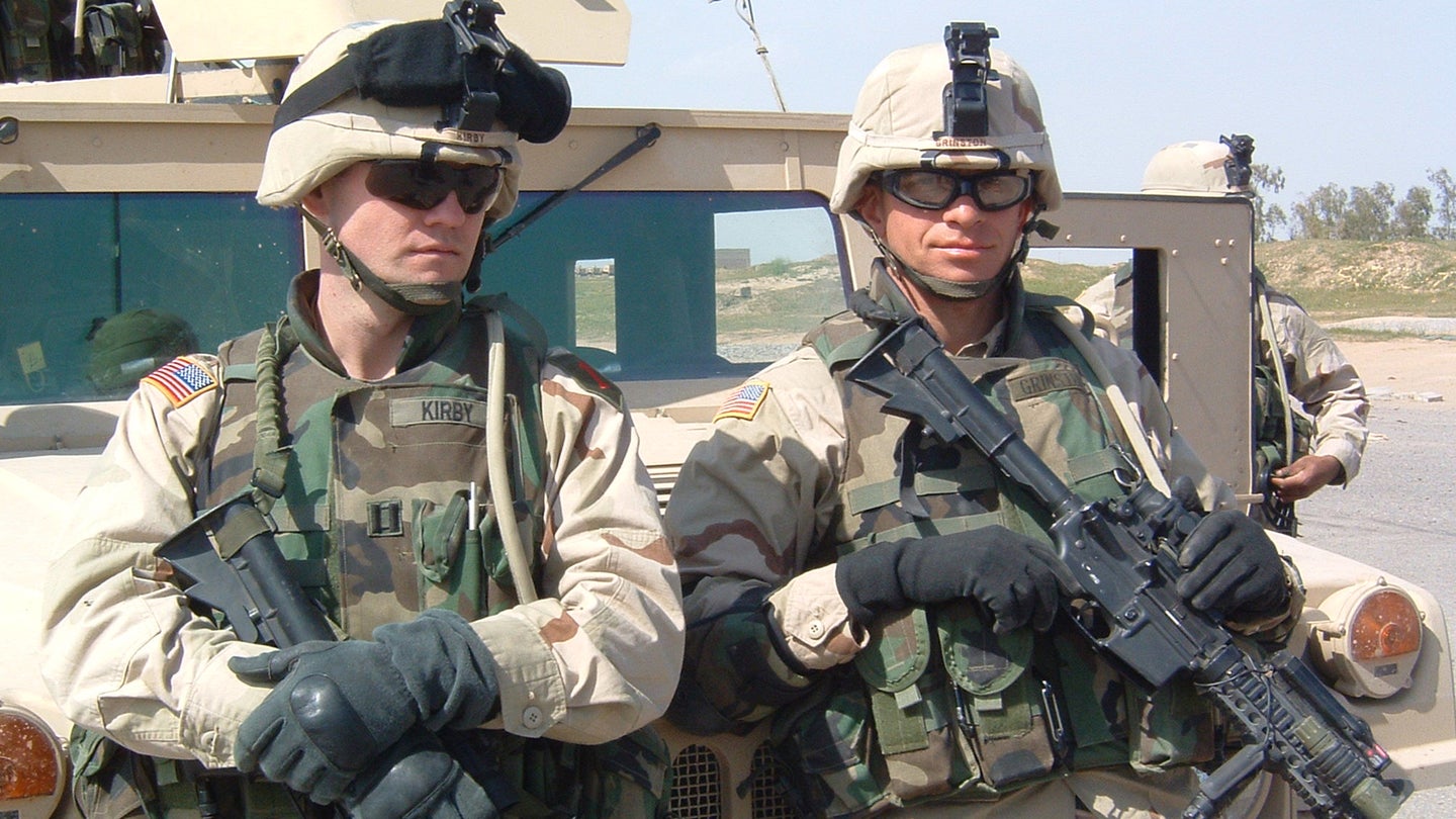 Capt. Bill Kirby, Company Commander of C/1-7 FA during the first half of C/1-7’s OIF II deployment, and 1st Sgt. Michael Grinston, on patrol near Baiji, Iraq, 2004. (Courtesy photo via Brendan Dignan)
