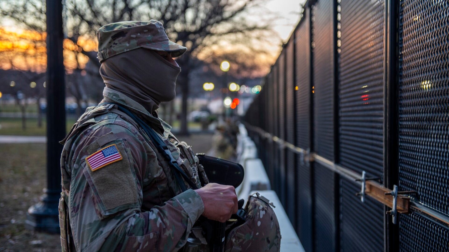 An Oklahoma National Guard soldier stands watch along a perimeter fence near the U.S. Capitol building in Washington, D.C., Jan. 20, 2021.